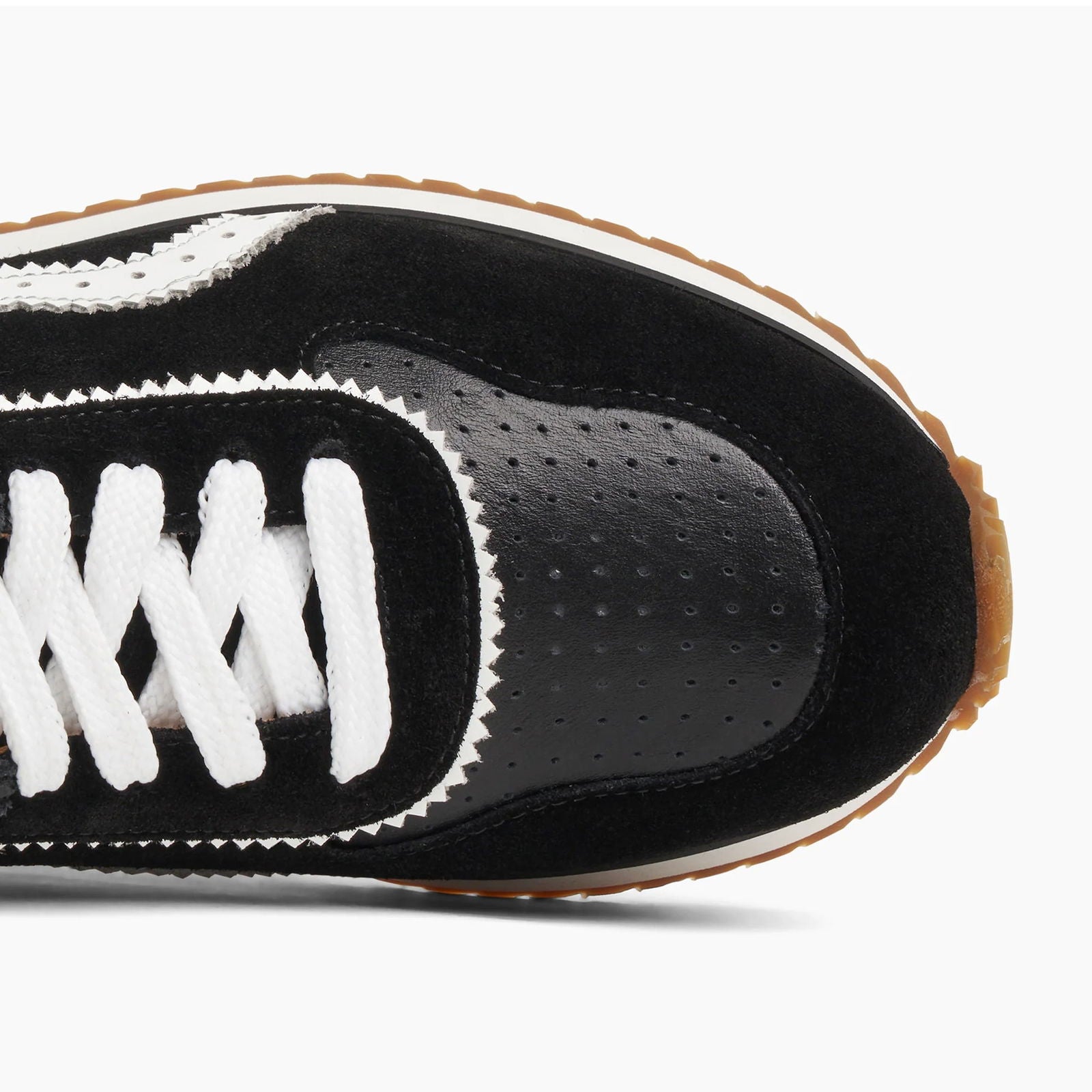 the Remi Sneaker Black - Milanese Leather